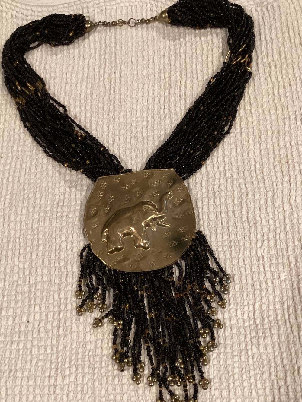 Black Beaded Necklace with Gold Elephant Medallion